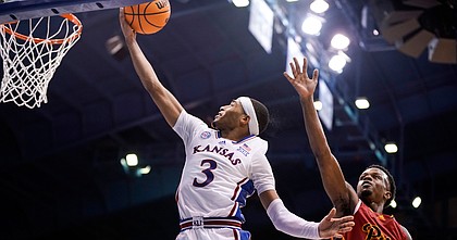 Kansas guard Dajuan Harris Jr. (3) gets in for a bucket against Pittsburg State guard Magic Reliford (11) during the second half of an exhibition on Thursday, Nov. 3, 2022 at Allen Fieldhouse.