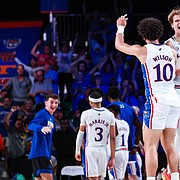 Kansas players Jalen Wilson (10) and Gradey Dick (4) celebrate the Jayhawks' wild, 69-68 overtime win over Wisconsin in the semifinals of the Battle 4 Atlantis tournament on Thursday, Nov. 24, 2022. 