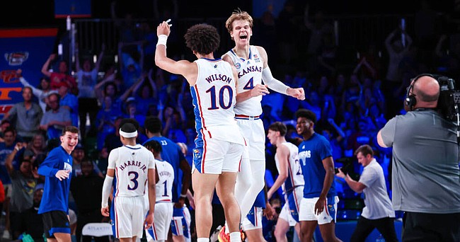 Kansas players Jalen Wilson (10) and Gradey Dick (4) celebrate the Jayhawks' wild, 69-68 overtime win over Wisconsin in the semifinals of the Battle 4 Atlantis tournament on Thursday, Nov. 24, 2022. 