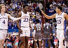 Kansas guard Kevin McCullar Jr. (15) slaps hands with Kansas guard Gradey Dick (4) and Kansas center Ernest Udeh Jr. (23) during a timeout in the second half against Seton Hall on Thursday, Dec. 1, 2022 at Allen Fieldhouse.
