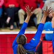 Nebraska's Madi Kubik, right, hits the ball over Kansas' Camryn Turner (22) and Lauren Dooley in the second set during a second round match of the NCAA college volleyball tournament, Friday, Dec. 2, 2022, at the Devaney Sports Center, in Lincoln, Neb. (Kenneth Ferriera/Lincoln Journal Star via AP)