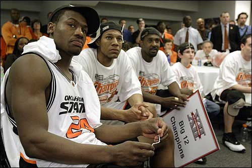 Oklahoma State players, from left, Tony Allen, Joey Graham and Ivan
McFarlin watch the NCAA Tournament selection show after the Big 12
Conference tournament championship game. The Cowboys were selected
as the No. 2 seed in the East Rutherford (N.J.) Regional and will
play in Kansas City, Mo., after beating Texas, 65-49, Sunday in
Dallas.
