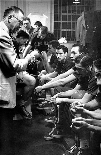 26 APR 1952:  University of Kansas coach Dr. Forrest "Phog" Allen gives his final instructions to his team before playing and winning the NCAA Men's Basketball Final Four held in Seattle, WA at the Edmundson Pavilion. Kansas defeated St. John's 80-63 for the title. future North Carloina coach Dean Smith (facing camera) was a junior at Kansas.
