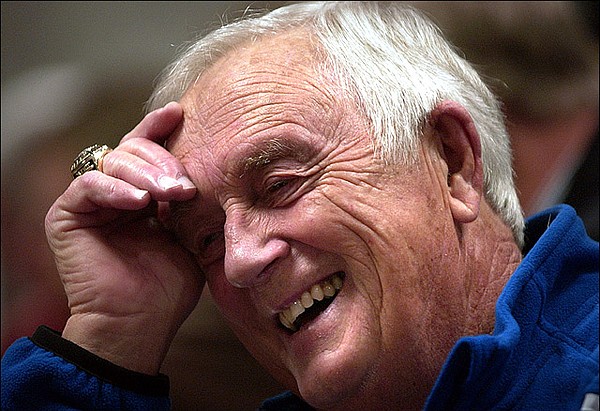 Longtime Kansas University basketball radio broadcaster Max Falkenstein enjoys a laugh in the media room prior to the start of a 2006 home game against Yale at Allen Fieldhouse. 