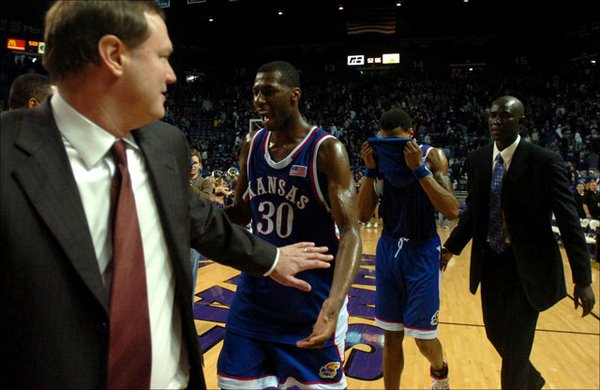 Kansas guard Julian Wright celebrates with head coach Bill Self as the Jayhawks make their way from the court after defeating Kansas State 66-52 Saturday at Bramlage Colliseum.