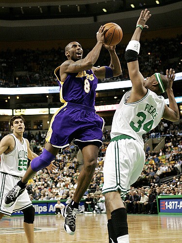 The Lakers' Kobe Bryant drives to the basket on the Boston Celtics' Paul Pierce, right. Bryant scored 43 points as the Lakers cruised past the Celtics in Boston.