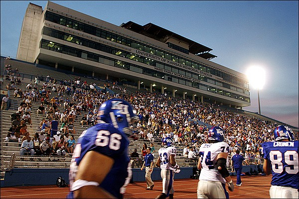 The Kansas football team is welcomed back to the field by a large crowd during a team scrimmage in 2006 at Memorial Stadium.