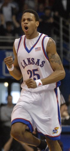 Kansas guard Brandon Rush pumps his fist during the first half of Saturday's game against the Longhorns at Allen Fieldhouse.