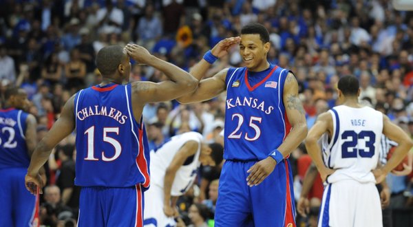 Kansas guard Mario Chalmers and Brandon Rush salute each other in overtime Monday, April 7, 2008 at the Alamodome in San Antonio.