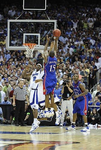 Kansas guard Mario Chalmers elevates for the three-pointer that put the game into overtime. Chalmers connected with 2.1 seconds left to tie it at 63, and the Jayhawks went on to win, 75-68 in overtime, April 7, 2008, in San Antonio.
