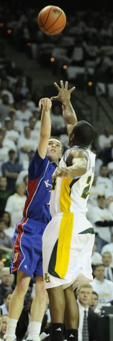 Kansas guard Brady Morningstar puts up a three over Baylor guard LaceDarius Dunn during the first half Monday, Feb. 2, 2009 at the Ferrell Center in Waco.