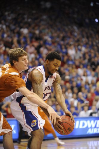 UT's Clint Chapman tries to take the ball from Kansas forward Marcus Morris on Saturday, March 7, 2009 at Allen Fieldhouse.