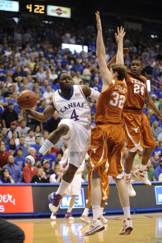 Kansas guard Sherron Collins looks to pass against the Texas defense on Saturday, March 7, 2009 at Allen Fieldhouse.