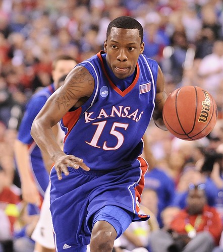 Kansas guard Tyshawn Taylor charges up the court after a steal during the first half Friday, March 27, 2009 at Lucas Oil Stadium in Indianapolis.