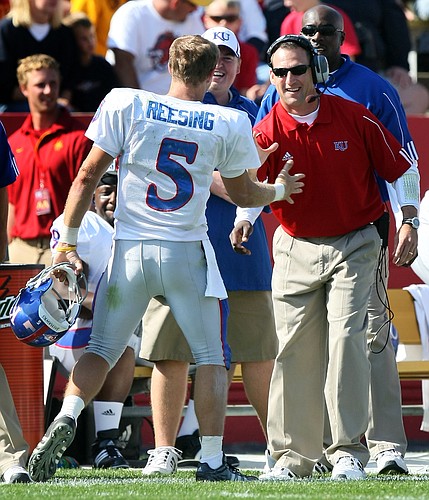 Kansas University receivers coach David Beaty, right, congratulates Todd Reesing on a play in this file photo from last season. Beaty has established himself as one of the top recruiters in the Big 12 Conference.