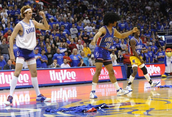 Jeff Withey, left, Xavier Henry, center, and Elijah Johnson dance during a freshman skit at the 2009 Late Night in the Phog.