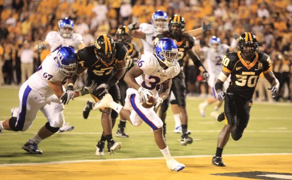 An excited Kansas running back Deshaun Sands scampers in for a touchdown against Southern Miss during the third quarter, Friday, Sept. 17, 2010 at M.M. Roberts Stadium in Hattiesburg, Mississippi.