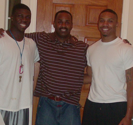 Lubbock Smith, right, is shown with current Texas A&M football player Cyrus Gray, left, and godfather Willie Weeks. Gray and Smith were teammates during youth football in Dallas.