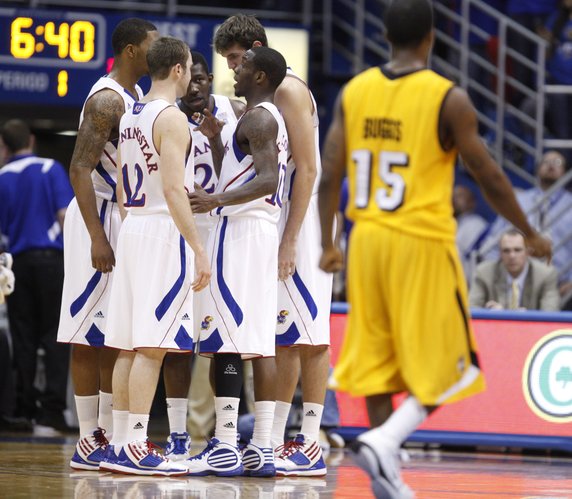 The Jayhawks talk strategy during a timeout against Valparaiso during the first half, Monday, Nov. 15, 2010 at Allen Fieldhouse.