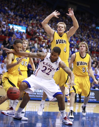 Kansas forward Marcus Morris gets physical as he clears out Valparaiso guard Jay Harris, left, while going for a loose ball during the first half, Monday, Nov. 15, 2010 at Allen Fieldhouse. Also pictured are Valpo defenders Kevin Van Wijk (55), Cory Johnson (4) and Ryan Broekhoff (45).