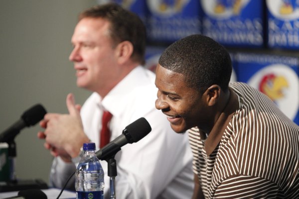 Kansas freshman guard Josh Selby laughs with head coach Bill Self during a news conference announcing that Selby will be released to play following a nine-game suspension. Selby's first game will be Saturday against USC.