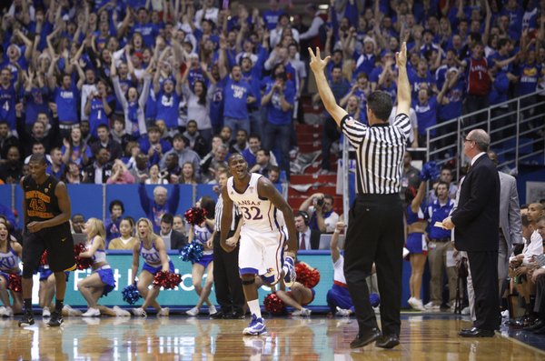 Kansas guard Josh Selby licks his chops after hitting a second three-pointer against USC during the first half, Saturday, Dec. 18, 2010 at Allen Fieldhouse.