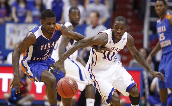 Kansas guard Tyshawn Taylor forces a turnover against UT Arlington's Darius Richardson during the first half, Wednesday, Dec. 29, 2010 at Allen Fieldhouse.