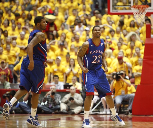 Kansas forward Marcus Morris (22) clenches his fists as he and twin brother Markieff head back on defense after a Jayhawk bucket against Iowa State during the second half. Marcus had 33 points and Markieff 17 in the Jayhawks’ 84-79 victory Wednesday in Ames, Iowa.