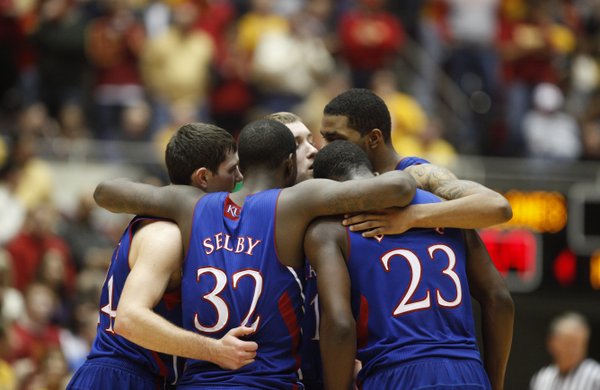 From left, Kansas players Tyrel Reed, Brady Morningstar, Marcus Morris, Mario Little and Josh Selby come together after a timeout against Iowa State during the second half on Wednesday, Jan. 12, 2011 at Hilton Coliseum in Ames, Iowa.