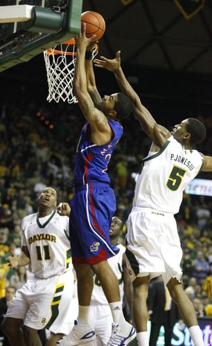 Kansas forward Markieff Morris powers in a bucket past Baylor forward Perry Jones during the first half on Monday, Jan. 17, 2011 at the Ferrell Center in Waco, Texas.