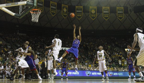 Kansas forward Marcus Morris (22) fades for a bucket in front of the Baylor defense during the first half. Morris had 25 points in the Jayhawks’ 85-65 victory over the Bears on Monday in Waco, Texas.