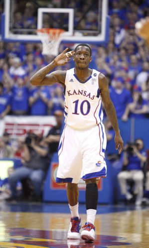 Kansas guard Tyshawn Taylor salutes after a three-pointer against Colorado during the first half on Saturday, Feb. 19, 2011 at Allen Fieldhouse.