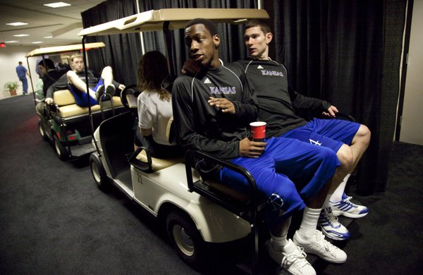 Kansas guards Tyshawn Taylor and Tyrel Reed wait to be escorted to press conferences on Saturday, March 26, 2011 at the Alamodome in San Antonio.