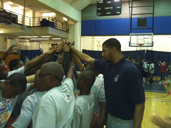 Markieff Morris huddles up with participants at an NBA Cares event in New York on Wednesday, June 22, the day before the 2011 NBA draft.