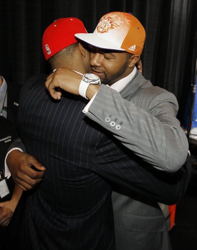 Twin brothers Markieff, right, and Marcus Morris, who played together at Kansas, embrace each other after they were picked No. 13 and No. 14, respectively, during the NBA basketball draft, Thursday, June 23, 2011 in Newark, N.J. Markieff was picked by the Phoenix Suns while Marcus was picked by the Houston Rockets.