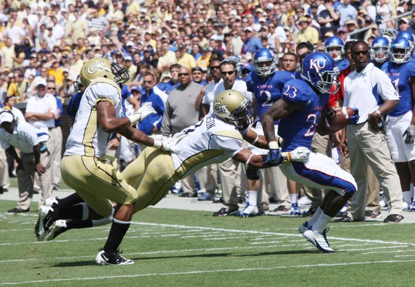 Kansas running back Tony Pierson is pushed out of bounds by Georgia Tech defenders on Saturday, Sept. 17, 2011 in Atlanta.
