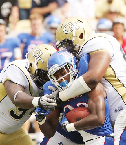 Kansas running back Tony Pierson is gobbled up by the Georgia Tech defense Saturday, Sept. 17, 2011 in Atlanta.