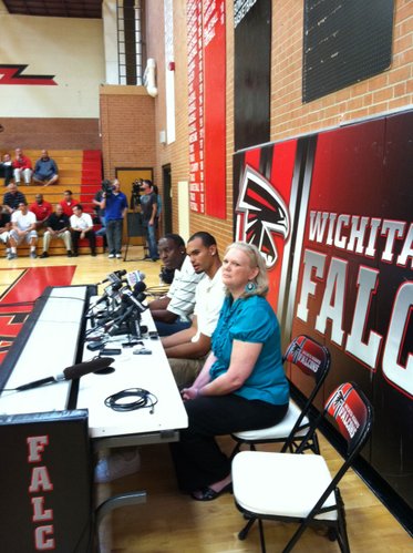 Perry Ellis, center, sits with his father, Will, and mother, Fonda, during his press conference on Wednesday at Wichita Heights High School. Ellis selected Kansas over Kansas State, Wichita State and Kentucky.