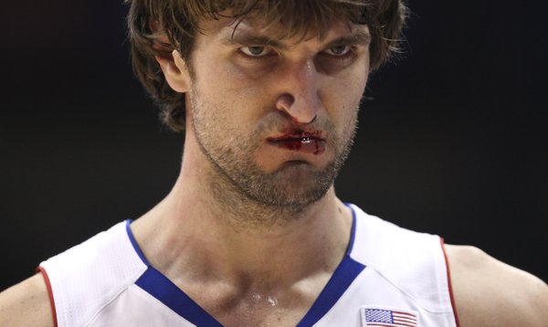 Kansas center Jeff Withey makes his way to the bench with a mouthful of blood following some physical play against Long Beach State during the second half on Tuesday, Dec. 6, 2011 at Allen Fieldhouse.