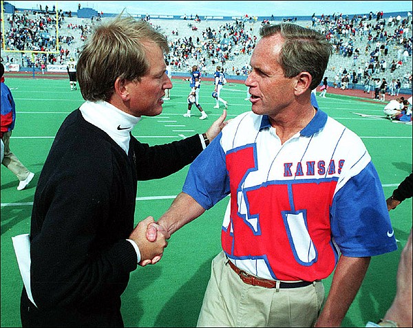 Former Colorado and Washington football coach Rick Neuheisel, left, and former KU coach Glen Mason, who went 47-54-1 from 1988-1996.