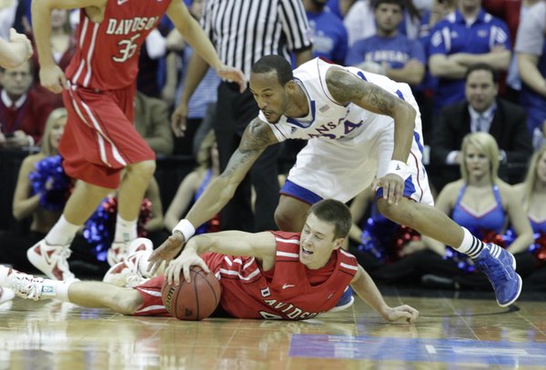 Kansas guard Travis Releford scrambles for a loose ball in the first half against Davidson on Monday, Dec. 19, 2011 at Sprint Center in Kansas City, Mo.