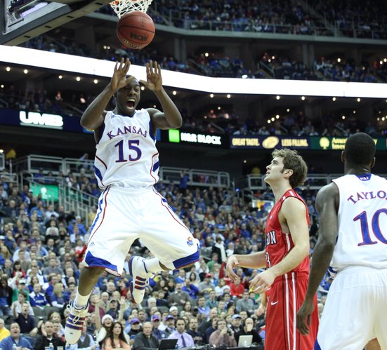 Kansas guard Elijah Johnson dunks on Davidson in the first half Monday, Dec. 19, 2011 at Sprint Center in Kansas City, Mo.