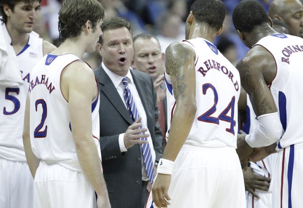 Kansas head coach Bill Self talks with the team during a timeout in the second half Monday, Dec. 19, 2011 at Sprint Center in Kansas City, Mo.