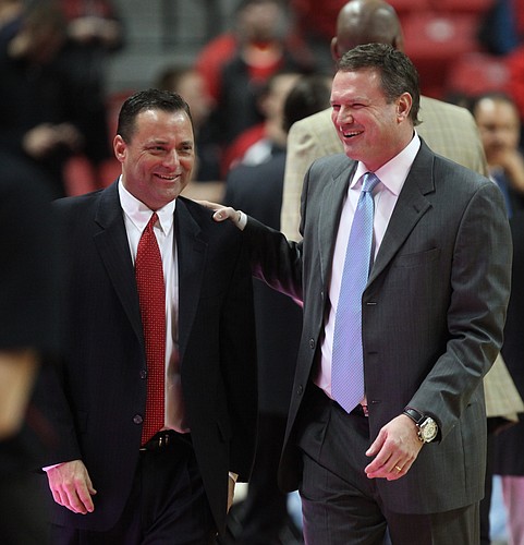 Kansas head coach Bill Self, right, laughs with Texas Tech head coach Billy Gillispie, who is Self's former assistant, prior to tipoff on Wednesday, Jan. 11, 2012, at United Spirit Arena.