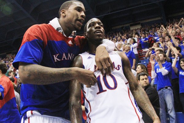 Kansas forward Thomas Robinson gives teammate Tyshawn Taylor a hug, at the end of regulation play as the two combined for a total 55 points against Baylor on Monday January 16, 2012 in Allen Fieldhouse.