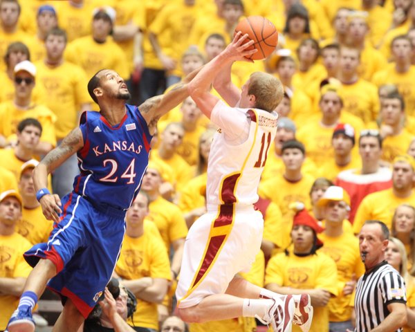 Kansas guard Travis Releford defends a shot from Iowa State guard Scott Christopherson during the second half on Saturday, Jan. 28, 2012 at Hilton Coliseum.