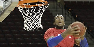 Kansas forward Thomas Robinson goes up for a reverse dunk during warmups before the Jayhawks' road game against Texas A&M on Wednesday, Feb. 22, 2012,  in College Station, Texas.