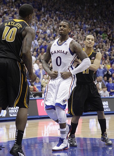 Thomas Robinson (0) looks at Ricardo Ratliffe (10) after Robinson made a layup to bring the Jayhawks within one point of the Tigers with  two and a half minutes left in regulation. The Jayhawks went on to win 87-86 against the Missouri Tigers, Saturday, Feb 25, 2012..
