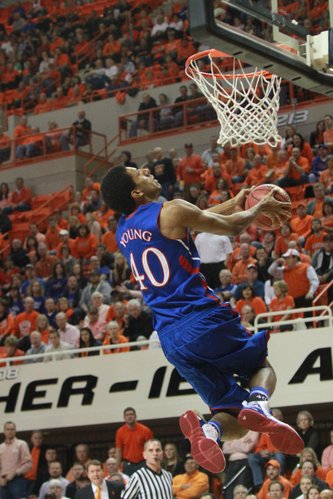 Kansas forward Kevin Young goes up for a reverse dunk during the first half of KU's game against Oklahoma State on Monday, Feb. 27, 2012, at Gallagher-Iba Arena in Stillwater, Okla.