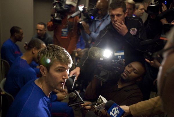 Kansas center Jeff Withey answers questions in the team's locker room prior to taking the court for practice at Century Link Center in Omaha.